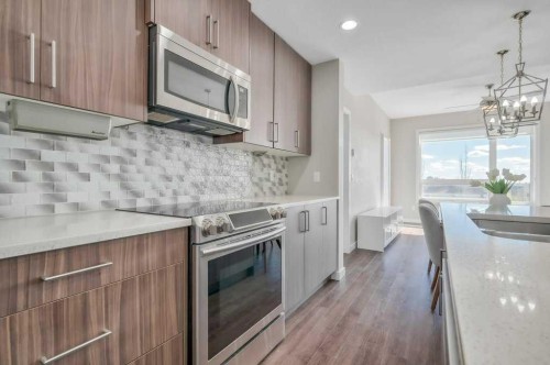 402-8531 8A Avenue Sw, Calgary, AB - Indoor Photo Showing Kitchen With Upgraded Kitchen