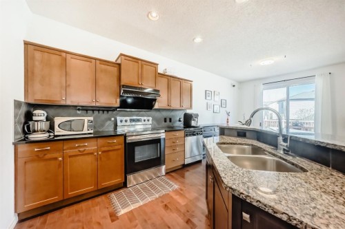 44 Aspen Hills Close Sw, Calgary, AB - Indoor Photo Showing Kitchen With Double Sink