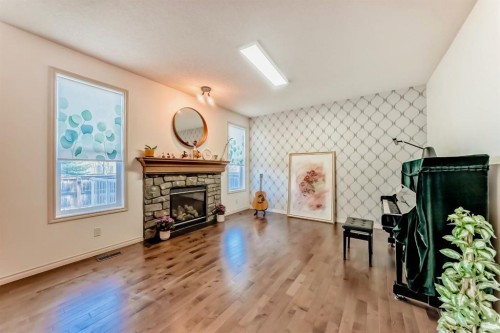44 Aspen Hills Close Sw, Calgary, AB - Indoor Photo Showing Living Room With Fireplace