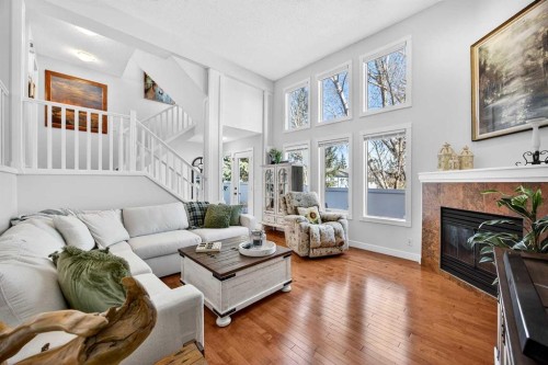 94 Candle Terrace Sw, Calgary, AB - Indoor Photo Showing Living Room With Fireplace