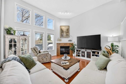 94 Candle Terrace Sw, Calgary, AB - Indoor Photo Showing Living Room With Fireplace