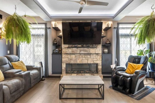 670 Muirfield Crescent, Lyalta, AB - Indoor Photo Showing Living Room With Fireplace