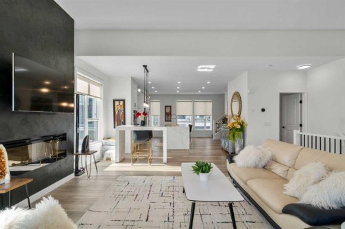 244 Sovereign Common Sw, Calgary, AB - Indoor Photo Showing Living Room With Fireplace