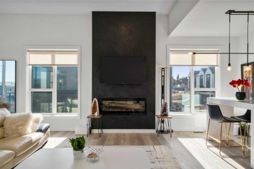 244 Sovereign Common Sw, Calgary, AB - Indoor Photo Showing Living Room With Fireplace