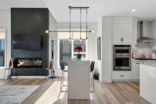 244 Sovereign Common Sw, Calgary, AB - Indoor Photo Showing Kitchen With Fireplace
