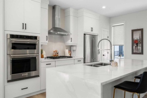 244 Sovereign Common Sw, Calgary, AB - Indoor Photo Showing Kitchen With Double Sink With Upgraded Kitchen