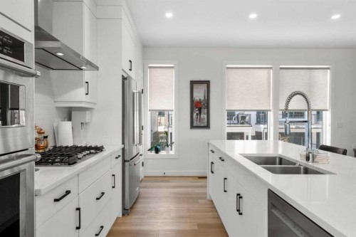 244 Sovereign Common Sw, Calgary, AB - Indoor Photo Showing Kitchen With Double Sink With Upgraded Kitchen