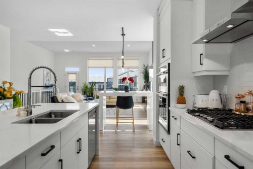 244 Sovereign Common Sw, Calgary, AB - Indoor Photo Showing Kitchen With Double Sink With Upgraded Kitchen