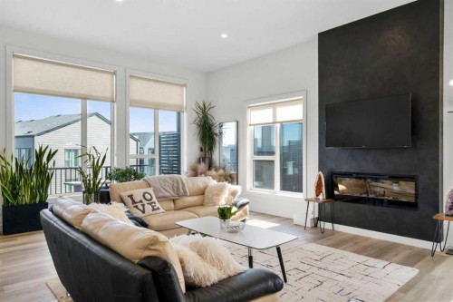 244 Sovereign Common Sw, Calgary, AB - Indoor Photo Showing Living Room With Fireplace