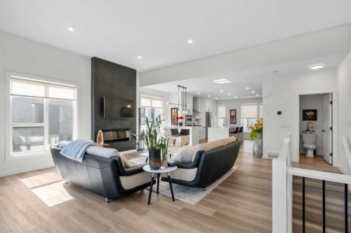 244 Sovereign Common Sw, Calgary, AB - Indoor Photo Showing Living Room With Fireplace