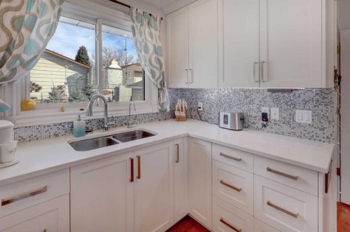 540 Lysander Drive Se, Calgary, AB - Indoor Photo Showing Kitchen With Double Sink