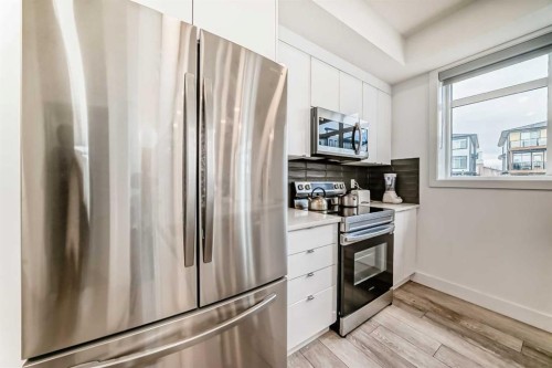 3112-410 Seton Passage Se, Calgary, AB - Indoor Photo Showing Kitchen