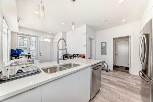 3112-410 Seton Passage Se, Calgary, AB - Indoor Photo Showing Kitchen With Stainless Steel Kitchen With Double Sink With Upgraded Kitchen