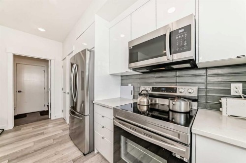 3112-410 Seton Passage Se, Calgary, AB - Indoor Photo Showing Kitchen With Stainless Steel Kitchen With Upgraded Kitchen
