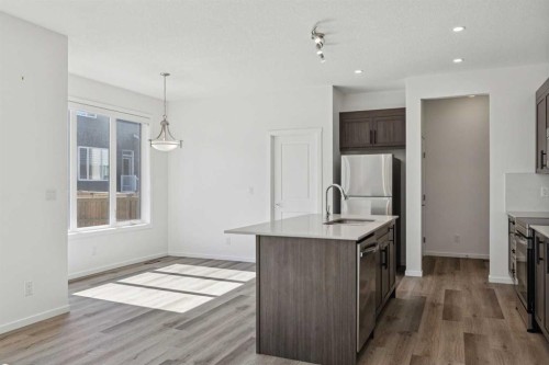 25 Yorkstone Row Sw, Calgary, AB - Indoor Photo Showing Kitchen With Upgraded Kitchen