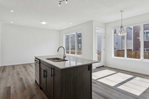 25 Yorkstone Row Sw, Calgary, AB - Indoor Photo Showing Kitchen With Double Sink