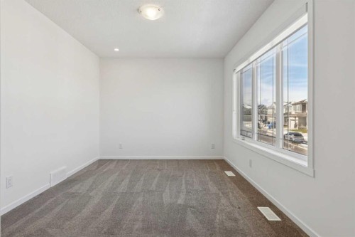 25 Yorkstone Row Sw, Calgary, AB - Indoor Photo Showing Other Room