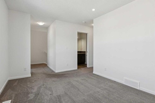 25 Yorkstone Row Sw, Calgary, AB - Indoor Photo Showing Other Room