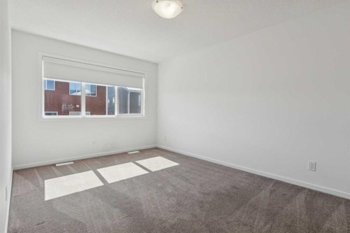 25 Yorkstone Row Sw, Calgary, AB - Indoor Photo Showing Other Room