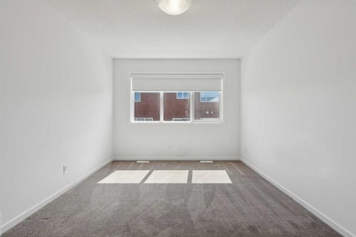 25 Yorkstone Row Sw, Calgary, AB - Indoor Photo Showing Other Room