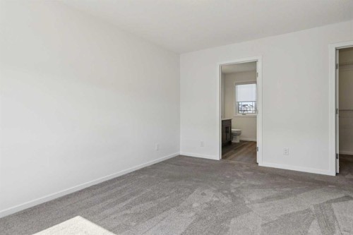 25 Yorkstone Row Sw, Calgary, AB - Indoor Photo Showing Other Room