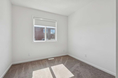 25 Yorkstone Row Sw, Calgary, AB - Indoor Photo Showing Other Room