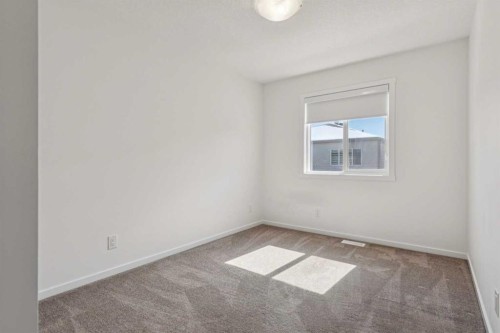 25 Yorkstone Row Sw, Calgary, AB - Indoor Photo Showing Other Room
