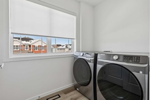 25 Yorkstone Row Sw, Calgary, AB - Indoor Photo Showing Laundry Room