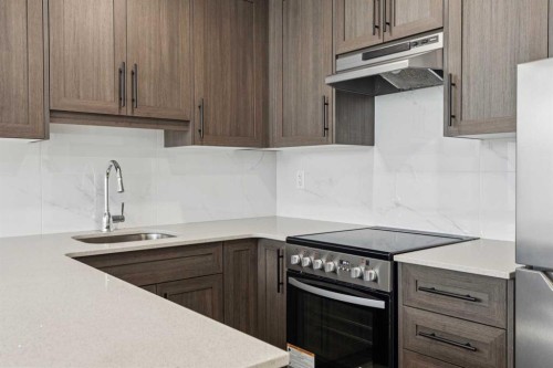 25 Yorkstone Row Sw, Calgary, AB - Indoor Photo Showing Kitchen With Stainless Steel Kitchen With Upgraded Kitchen