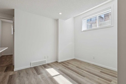 25 Yorkstone Row Sw, Calgary, AB - Indoor Photo Showing Other Room