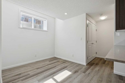 25 Yorkstone Row Sw, Calgary, AB - Indoor Photo Showing Other Room