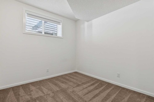 25 Yorkstone Row Sw, Calgary, AB - Indoor Photo Showing Other Room