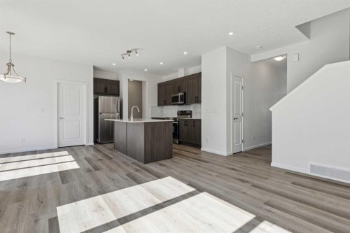 25 Yorkstone Row Sw, Calgary, AB - Indoor Photo Showing Kitchen With Stainless Steel Kitchen With Upgraded Kitchen