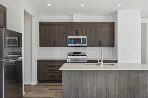 25 Yorkstone Row Sw, Calgary, AB - Indoor Photo Showing Kitchen With Stainless Steel Kitchen