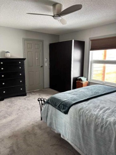 270165 Range Road 291 Se, Airdrie, AB - Indoor Photo Showing Bedroom