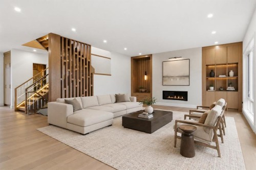 209 Windermere Road Sw, Calgary, AB - Indoor Photo Showing Living Room With Fireplace