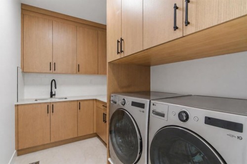 209 Windermere Road Sw, Calgary, AB - Indoor Photo Showing Laundry Room