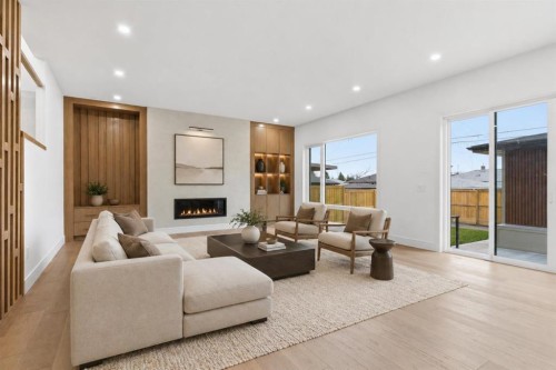 209 Windermere Road Sw, Calgary, AB - Indoor Photo Showing Living Room With Fireplace