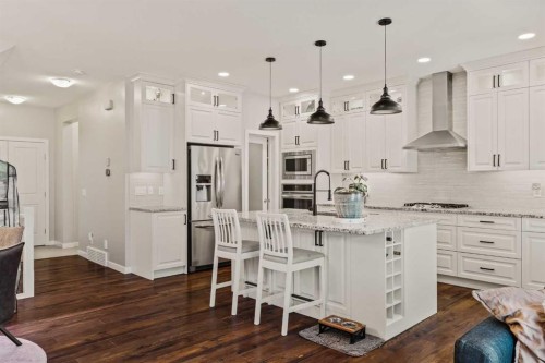 65 Sunrise Crescent, Cochrane, AB - Indoor Photo Showing Kitchen With Upgraded Kitchen