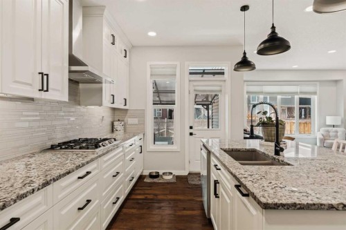 65 Sunrise Crescent, Cochrane, AB - Indoor Photo Showing Kitchen With Double Sink With Upgraded Kitchen