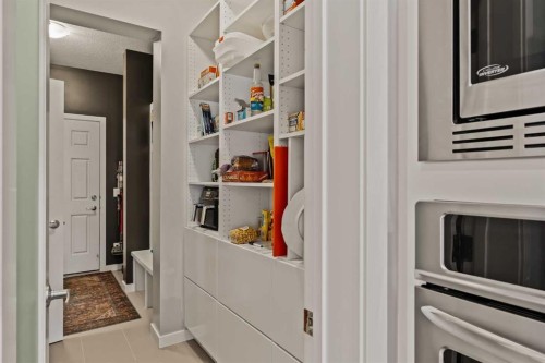 65 Sunrise Crescent, Cochrane, AB - Indoor Photo Showing Other Room