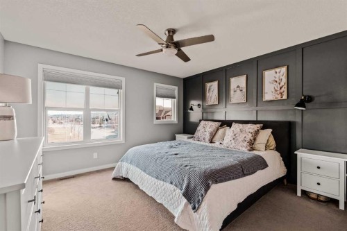 65 Sunrise Crescent, Cochrane, AB - Indoor Photo Showing Bedroom