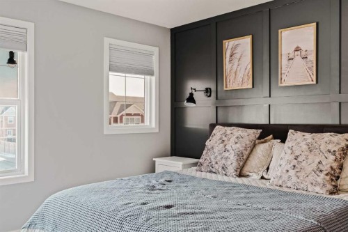 65 Sunrise Crescent, Cochrane, AB - Indoor Photo Showing Bedroom