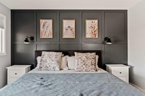 65 Sunrise Crescent, Cochrane, AB - Indoor Photo Showing Bedroom