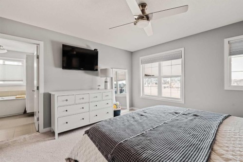 65 Sunrise Crescent, Cochrane, AB - Indoor Photo Showing Bedroom