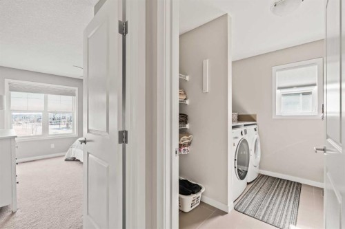 65 Sunrise Crescent, Cochrane, AB - Indoor Photo Showing Laundry Room
