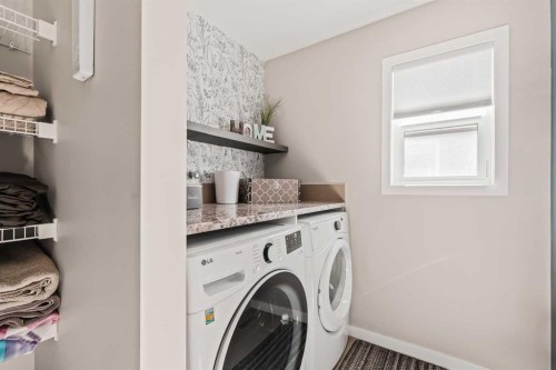65 Sunrise Crescent, Cochrane, AB - Indoor Photo Showing Laundry Room