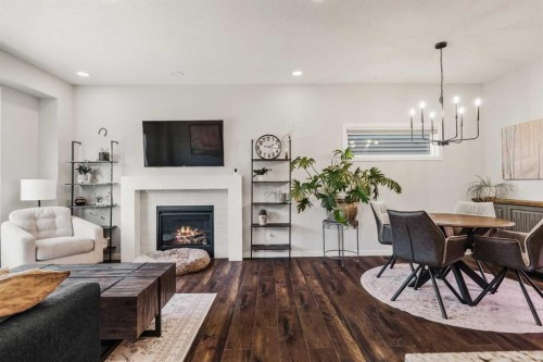 65 Sunrise Crescent, Cochrane, AB - Indoor Photo Showing Living Room With Fireplace