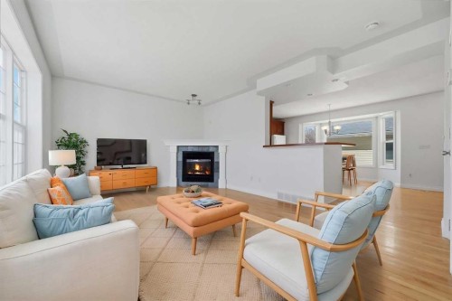 172 Somme Manor Sw, Calgary, AB - Indoor Photo Showing Living Room With Fireplace