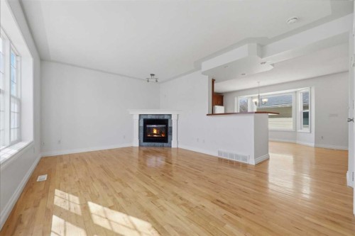 172 Somme Manor Sw, Calgary, AB - Indoor Photo Showing Other Room With Fireplace
